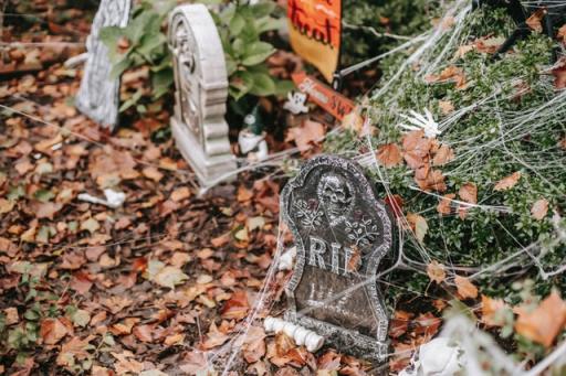 RIP Halloween tombstone in yard during fall season